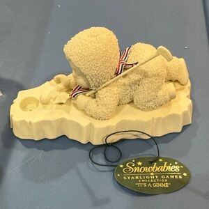 Department 56 Snowbabies Yellow Baby Figurine with Red-White-Blue Ribbon